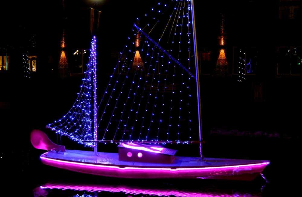 A purple LED strip light around a boat