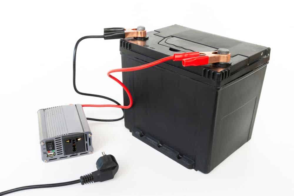 An inverter connected to a 12V rechargeable battery