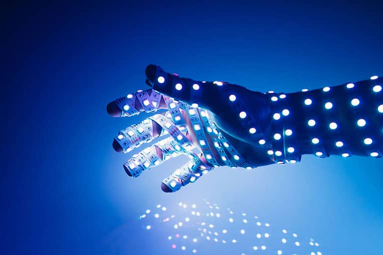 A human hand with colored LED lights