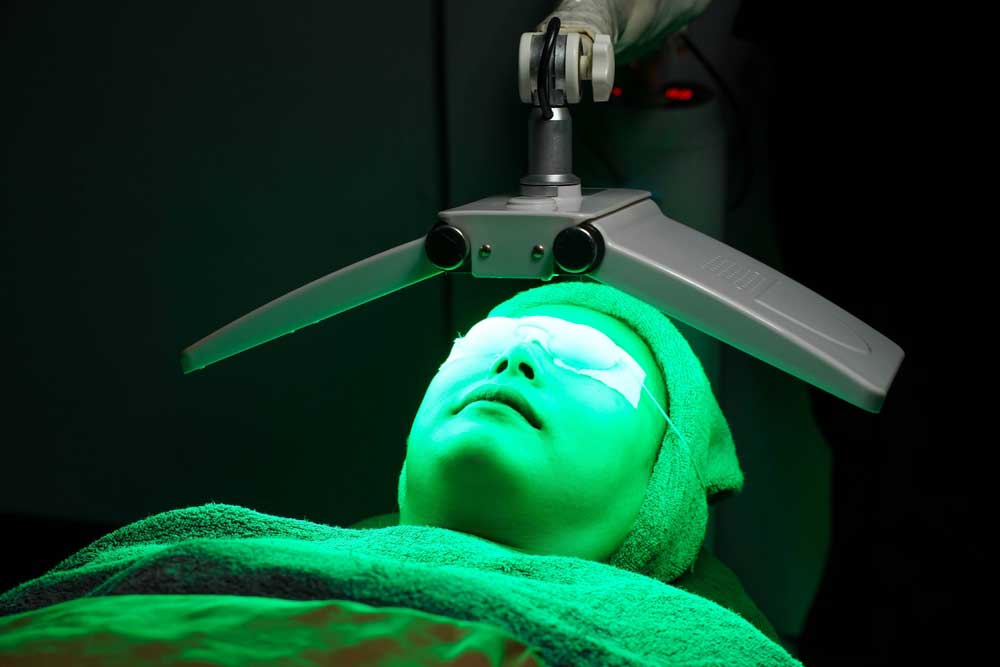 Person undergoing green light therapy