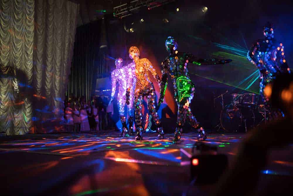 Performers wearing clothes with LED lights
